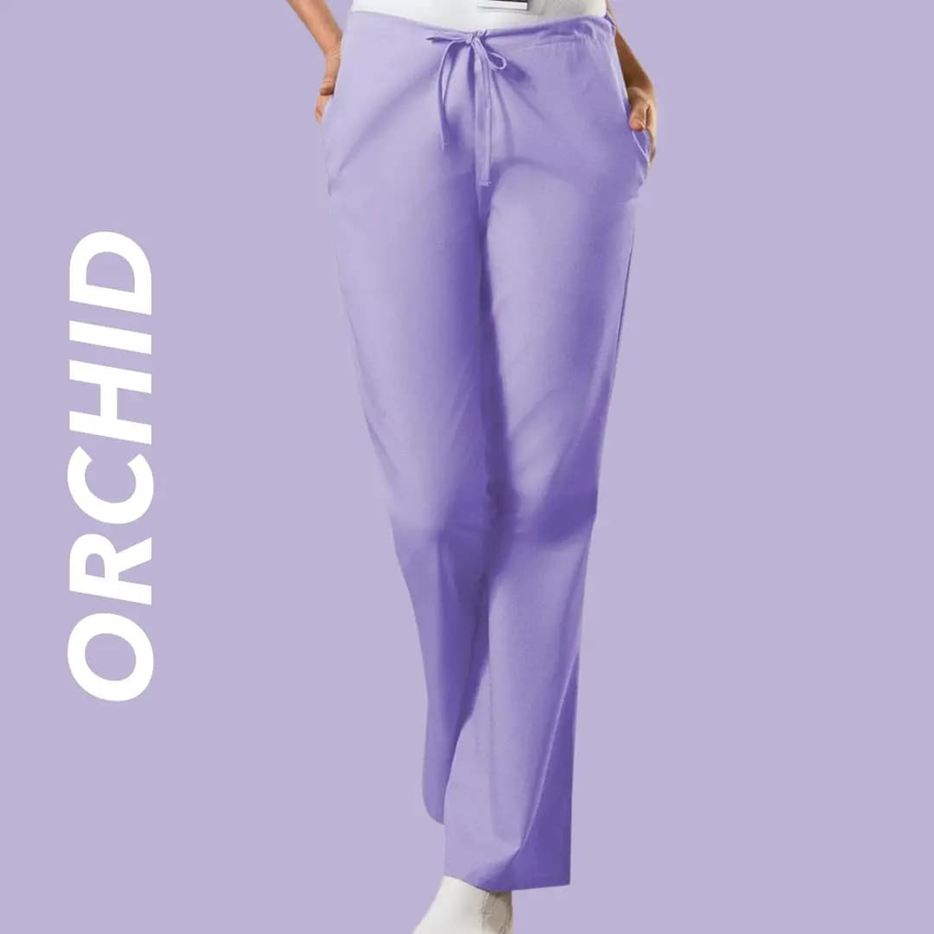 A young female Psychiatric Nurse wearing Orchid scrub pants on a lilac background with text to the left stating "Orchid".