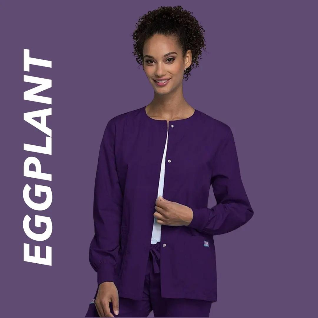 A young female Pediatric Nurse wearing Eggplant scrubs on a light purple background with text to the left stating "Eggplant".
