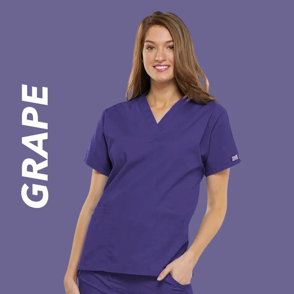 A young female Labor and Delivery Nurse wearing Grape colored scrubs on a light purple background with text to the left stating "Grape".