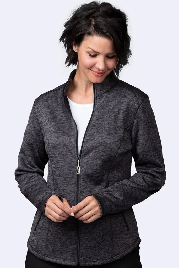 An image of a young female Physical Therapy Aide wearing a the Ava Therese Women's Bonded Fleece Jacket in Navy size XS featuring full zip closure for easy put on/removal.