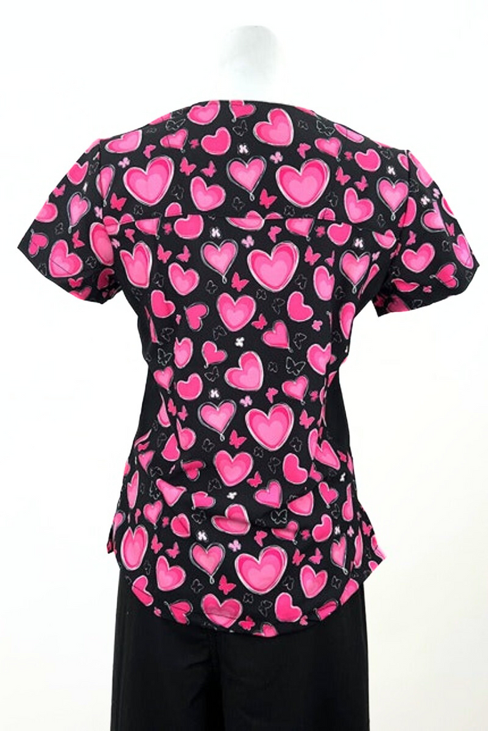 An image of the back of the Revel Women's Mock Wrap Print Scrub Top in size 3XL featuring side stretch panels to ensure comfortable fit all day long.