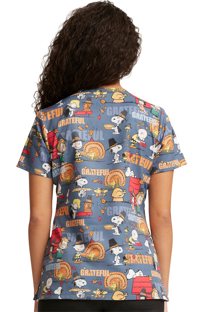 The back of a Tooniforms Women's V-Neck Print Scrub Top in "Grateful Snoopy" size medium featuring a center back length of 26".