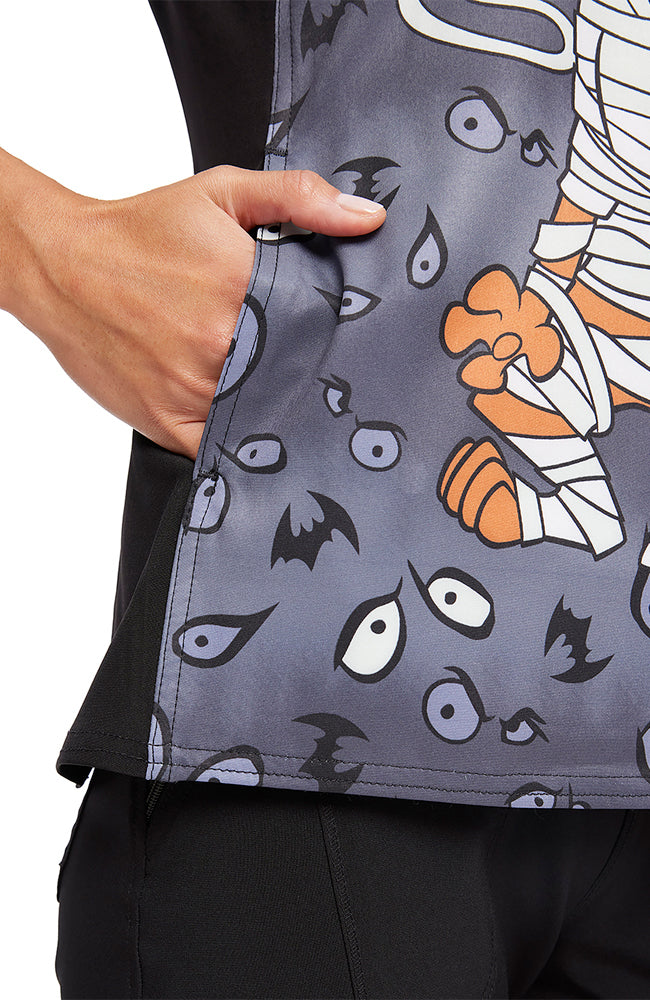 An up close shot of the double stitching throughout the Tooniforms Women's V-Neck Halloween Print Scrub Top in "Under Wraps".