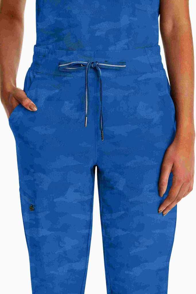 A close up shot of the waist of the Purple Label Women's Camo Scrub Jogger in Royal Blue featuring an elastic back and flat front.