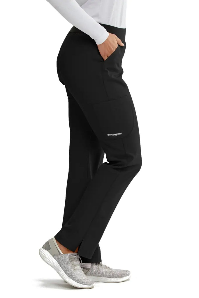 The Skechers Women's Elastic Waist Vitality Scrub Pant in black featuring an outside cargo pocket on the right side leg.