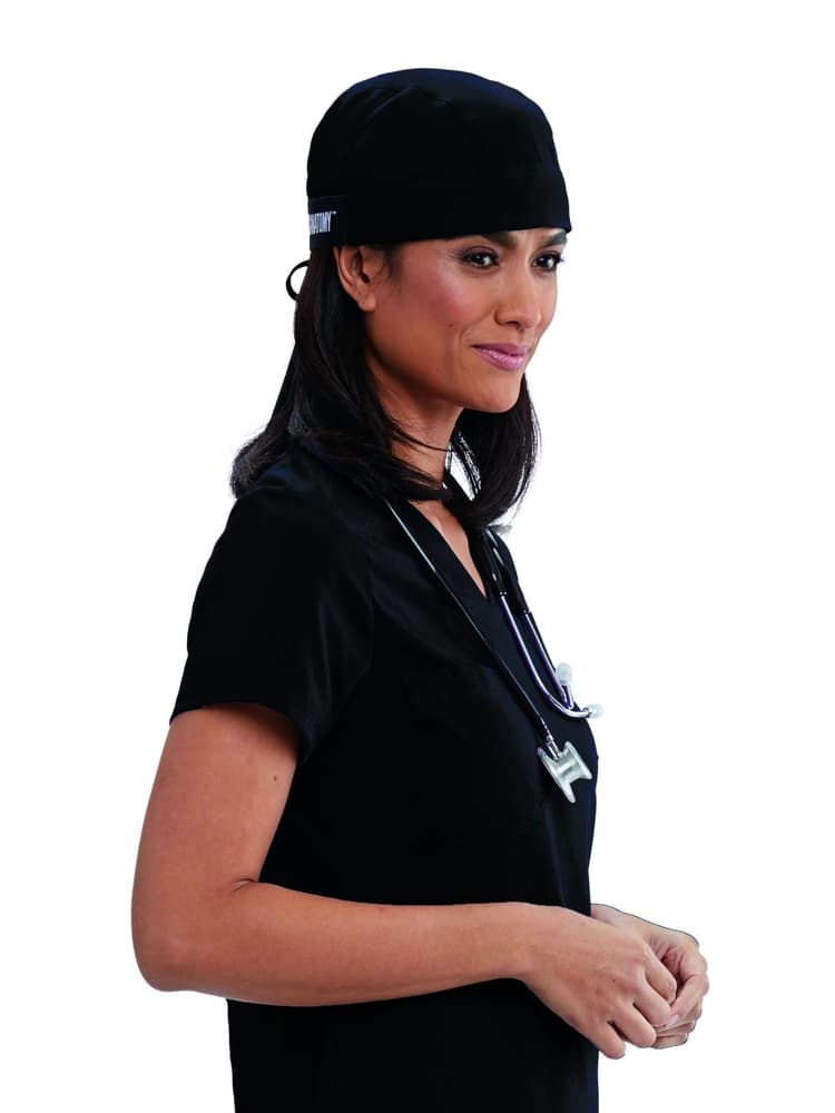 A young female Surgeon wearing a Grey's Anatomy Unisex Fitted Scrub Cap in Black  featuring a self tie at the back to ensure a perfect all day fit.