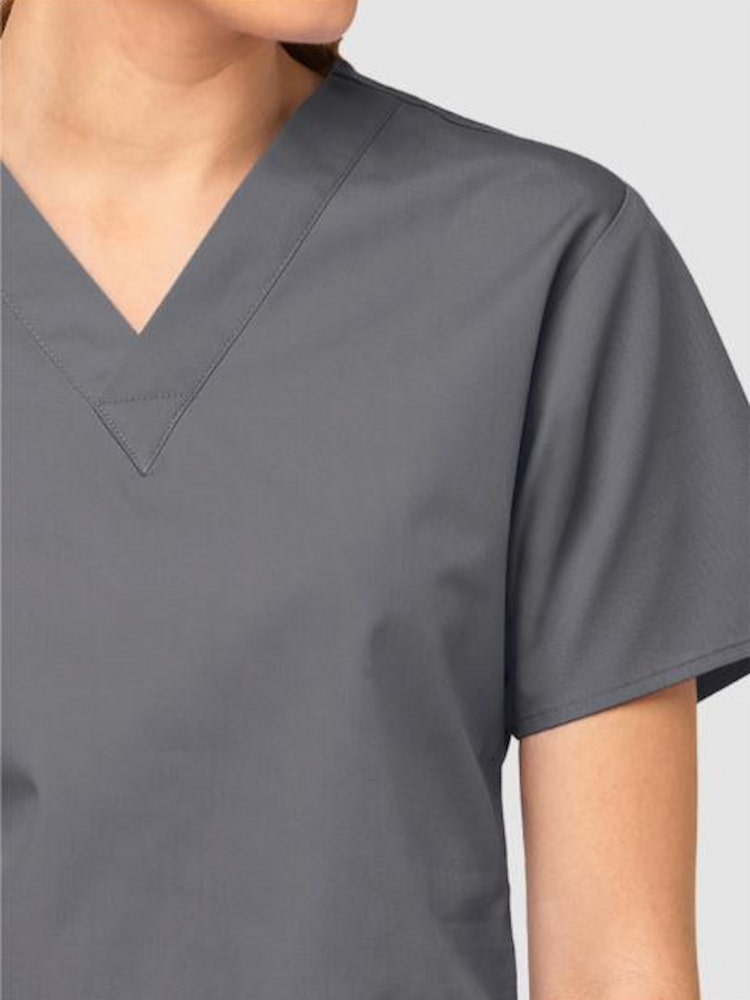 A up close image the neckline of the WonderWink Women's Bravo Scrub Top in Pewter size XXS featuring short sleeves.
