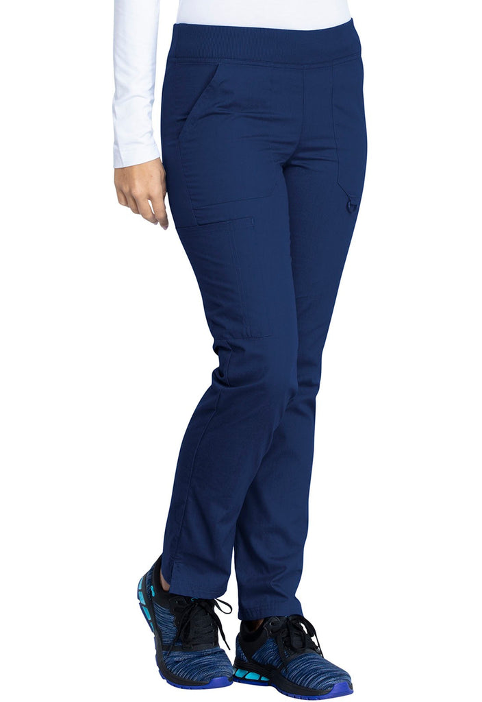 A young female Nurse wearing a Dickies EDS Signature Women's Mid Rise Tapered Leg Pull-on Pant in Navy size 2XL Petite featuring an adjustable interior drawstring.