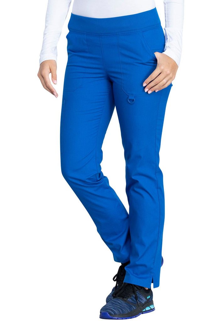 A young female Nurse wearing a Dickies EDS Signature Women's Mid Rise Tapered Leg Pull-on Pant in Royal size Small Petite featuring an adjustable interior drawstring.
