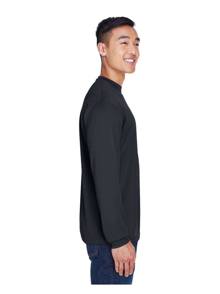 A young male Registered Nurse wearing an UltraClub Men's Cool & Dry Long Sleeve T-Shirt in Black size 3XL featuring a 100% polyester mesh fabric.