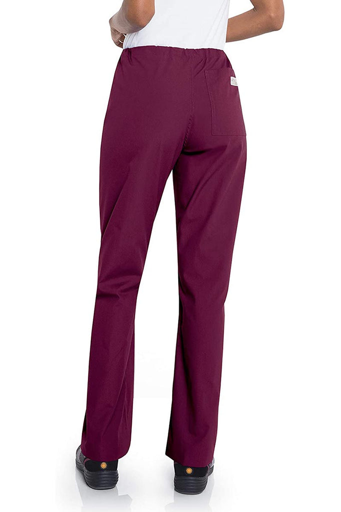 Female healthcare professional wearing a pair of Urbane Essentials Women's Straight-Leg Pants in "Wine'" featuring 1 back patch pocket.