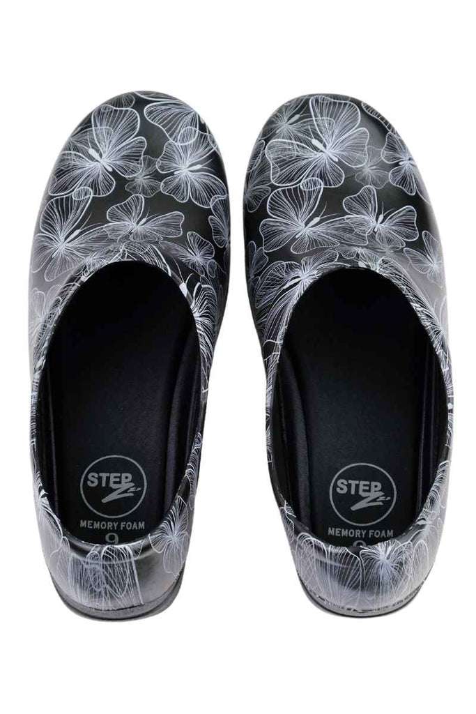 A frontward facing image of the StepZ Women's Slip Resistant Nurse Clogs in "Transparent Butterflies" size 9 featuring a classic slip on style.