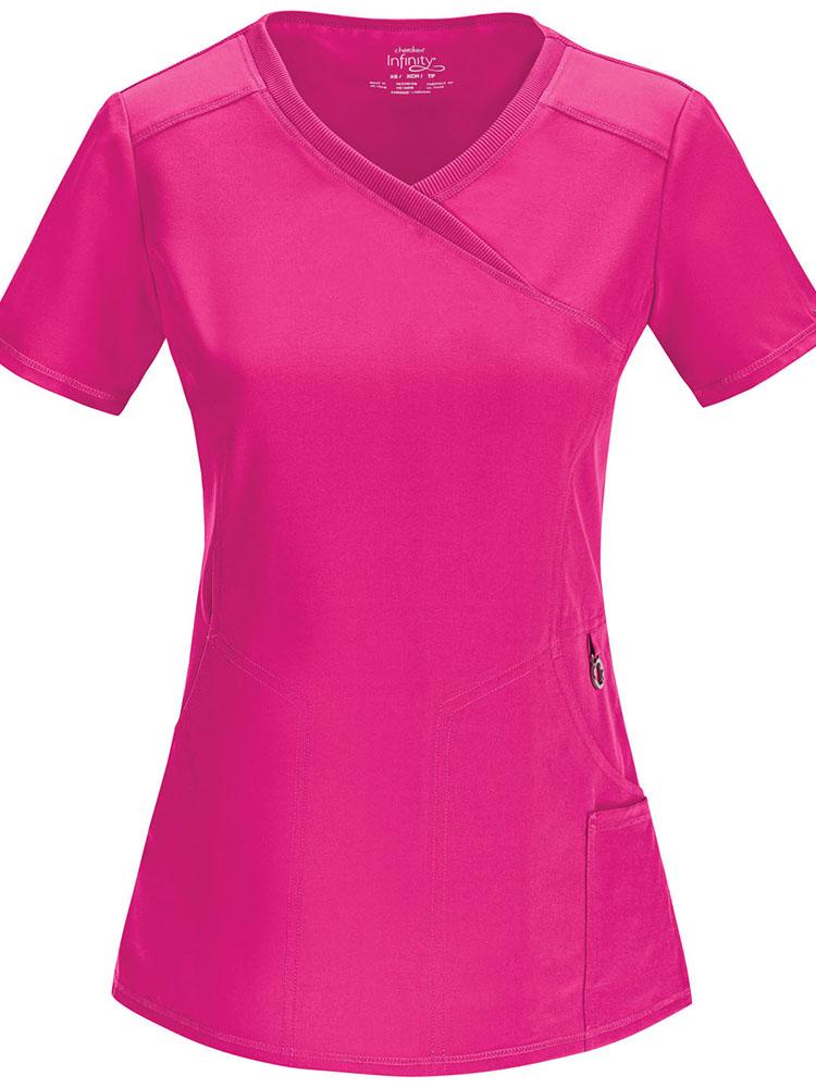 A frontward facing image of the Cherokee Infinity Women's Antimicrobial Mock Wrap Top in carmine pink size medium featuring a left scissor pocket & one interior pocket.