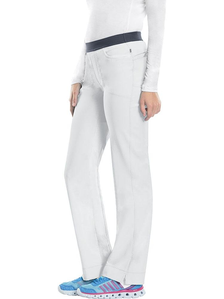 A young female Nurse Practitioner wearing a Cherokee Infinity Women's Low-Rise Slim Pull On Scrub Pant in White size Medium featuring an elastic waistband.