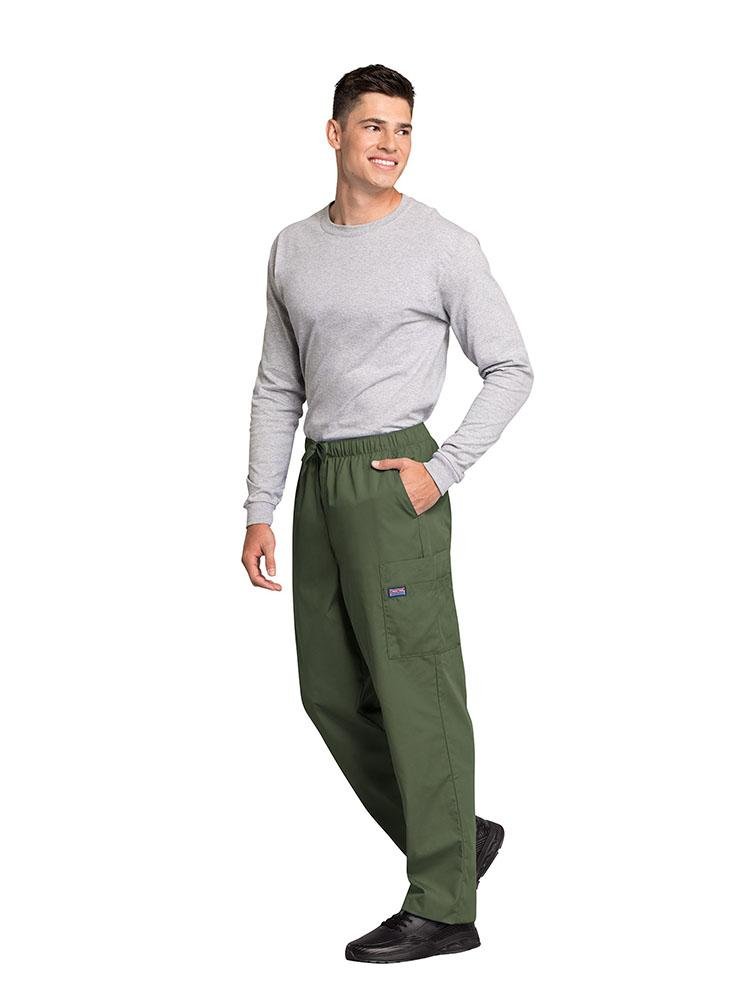 A male Veterinarian wearing a Cherokee Workwear Originals Men's Drawstring Cargo Scrub Pant in Olive size XL featuring 2 front slash pockets & a functional zip fly.