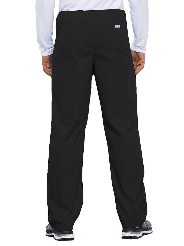 A young male Physical Therapist wearing a Cherokee Workwear Originals Unisex Drawstring Cargo Scrub Pant in Black featuring 1 back pocket.