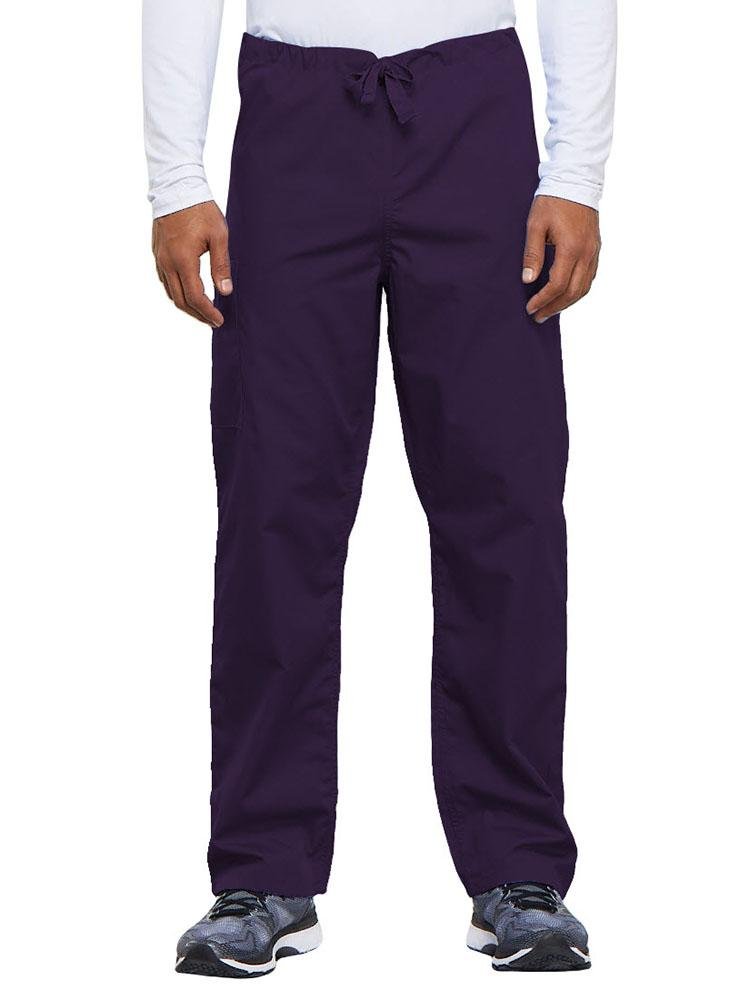 A young male Nurse Practitioner wearing a Cherokee Workwear Originals Unisex Drawstring Cargo Scrub Pant in Eggplant size Medium featuring a total of 3 pockets.
