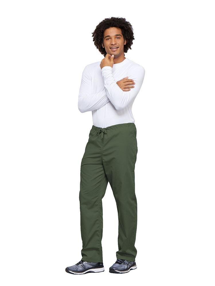 A young male Nurse wearing a Cherokee Workwear Unisex Drawstring Cargo Pant in Olive size 4XL featuring an inseam of 31".