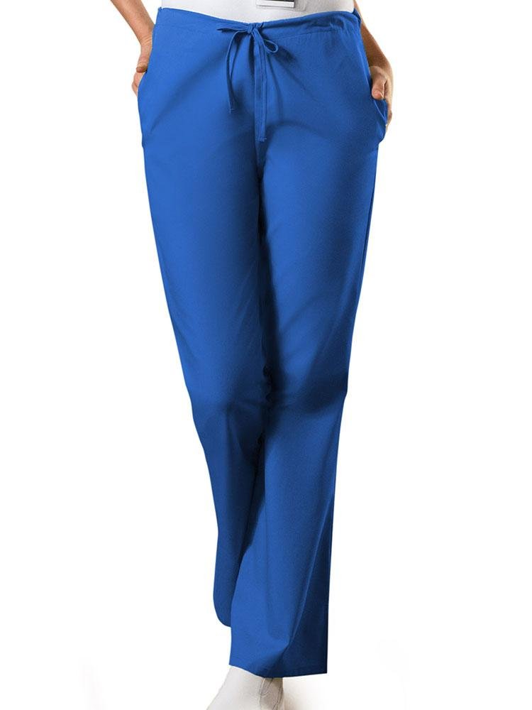 A young female LPN wearing a Cherokee Workwear Originals Women's Drawstring Flare Leg Scrub Pant in Royal size Medium Tall featuring a Modern Classic fit.