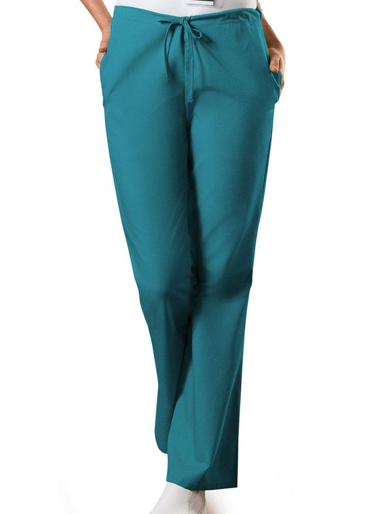 A young female Medical Assistant wearing a Cherokee Workwear Originals Women's Drawstring Flare Leg Scrub Pant in Teal size XS Petite featuring an adjustable drawstring waist.