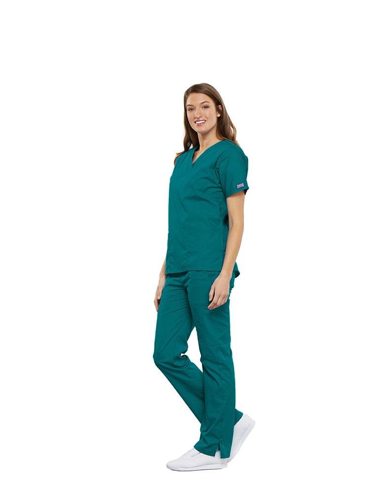 Medical Assistant wearing Cherokee Workwear Originals women's Multi-Pocketed V-Neck Scrub Top in teal size small