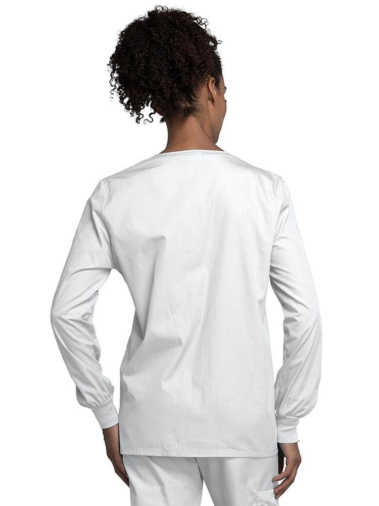 A view of the back of a Cherokee Workwear Originals Women's Snap Front Warm-Up Jacket in White size Medium with soil release fabric.