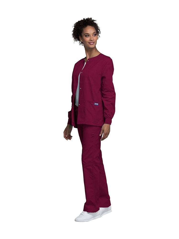 A female Dental Hygienist wearing a Cherokee Workwear Originals women's Snap Front Warm-Up Jacket in Wine size extra extra small featuring a unique polyester/cotton blend fabric.