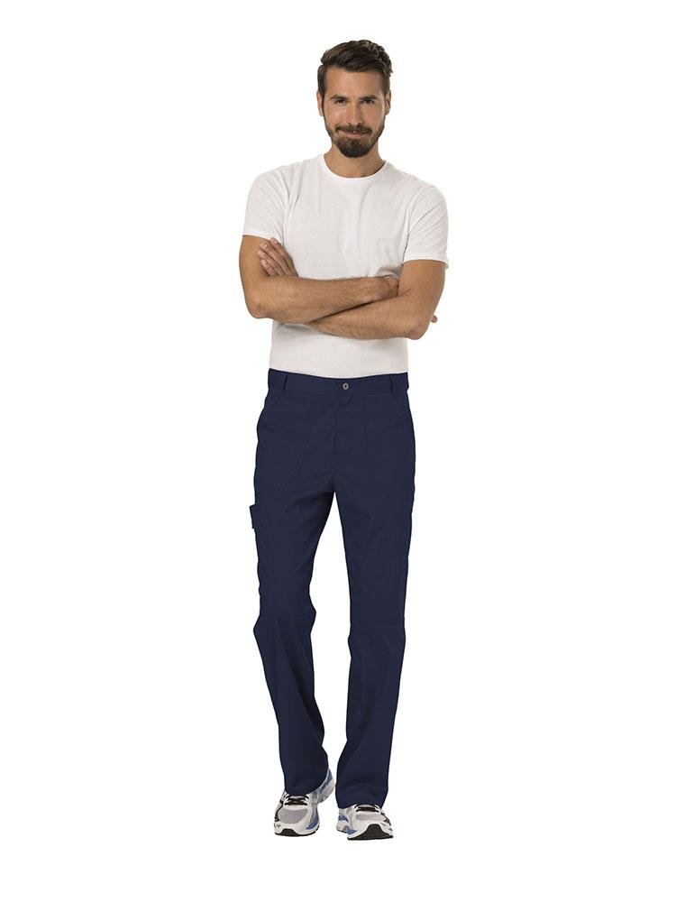 A male Occupational Therapist wearing a Cherokee Workwear Revolution Men's Drawstring Cargo Scrub Pant in Black size Medium featuring a total of 5 pockets.