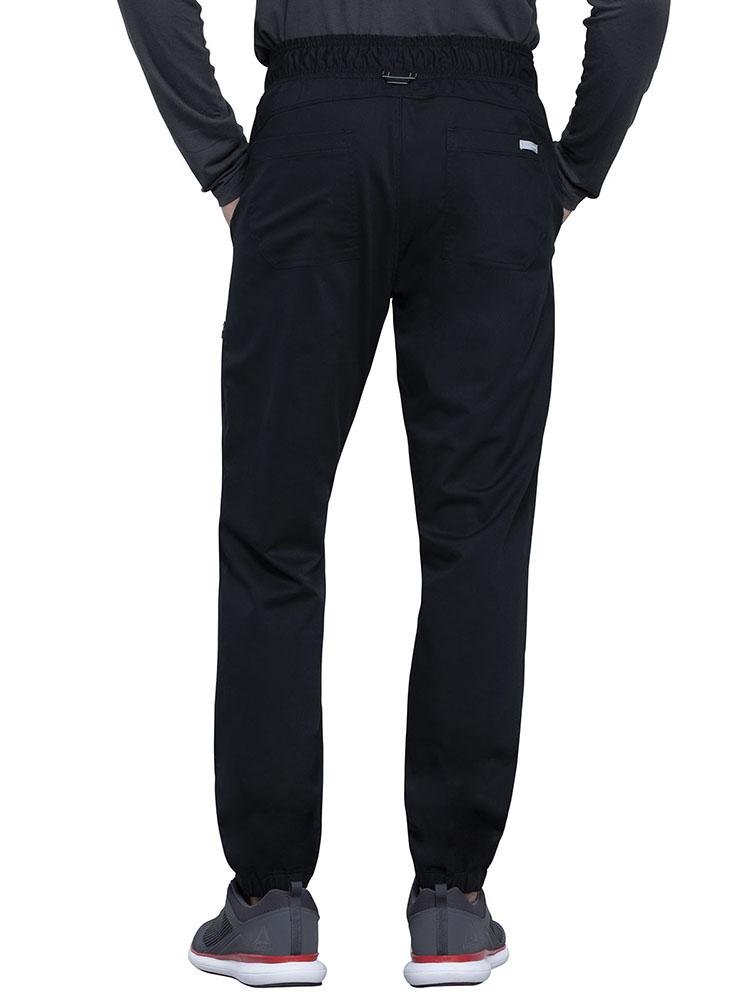Back view of Licensed Vocational Nurse wearing Cherokee Workwear Revolution men's Jogger Scrub Pant in black size large