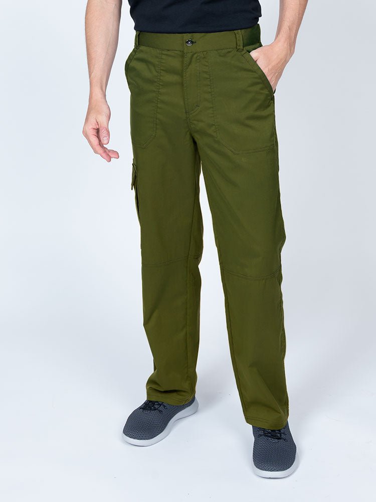 Man wearing an Epic by MedWorks Men's Button Front Scrub Pant in olive with metal button front closure.