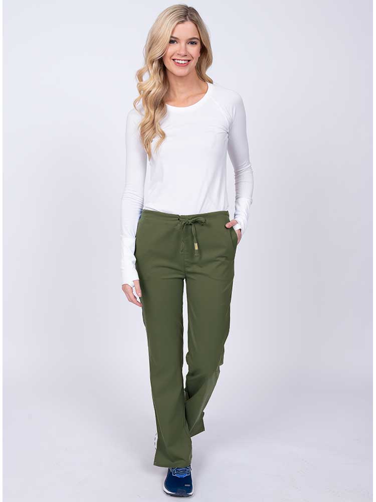 Woman wearing an Epic by MedWorks Women's Drawstring Flare Leg Scrub Pant in olive with 2 front slash pockets & 1 back pocket.