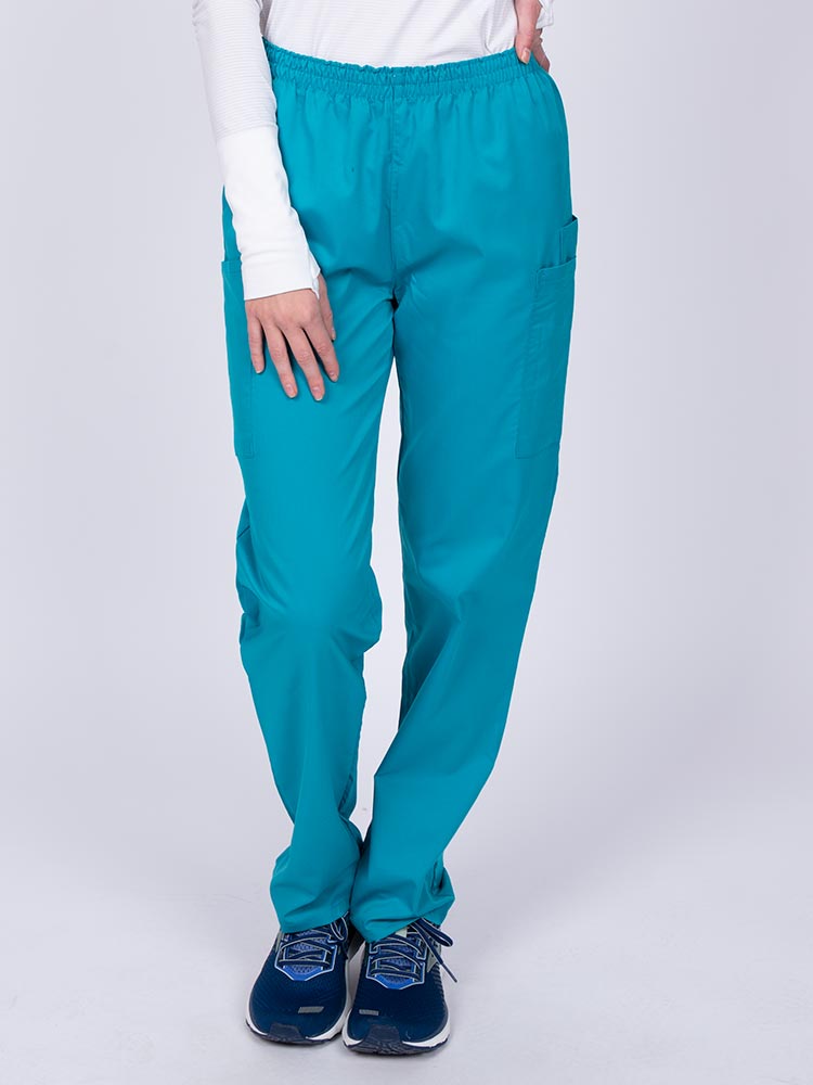 Woman wearing an Epic by MedWorks Women's Elastic Waist Scrub Pant in teal featuring a unique stretch fabric made of 77% Polyester, 21% Viscose, 2% Spandex.