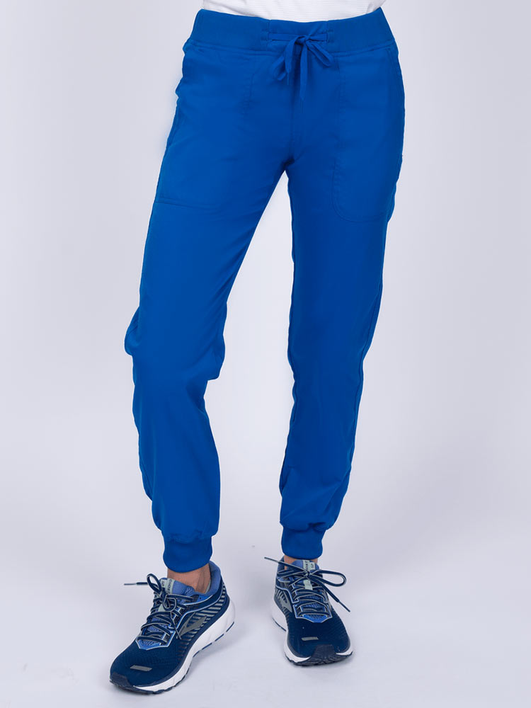 A young female Phlebotomist wearing an Epic by MedWorks Women's Yoga Jogger Scrub Pant in Royal size 3XL featuring a contemporary fit.