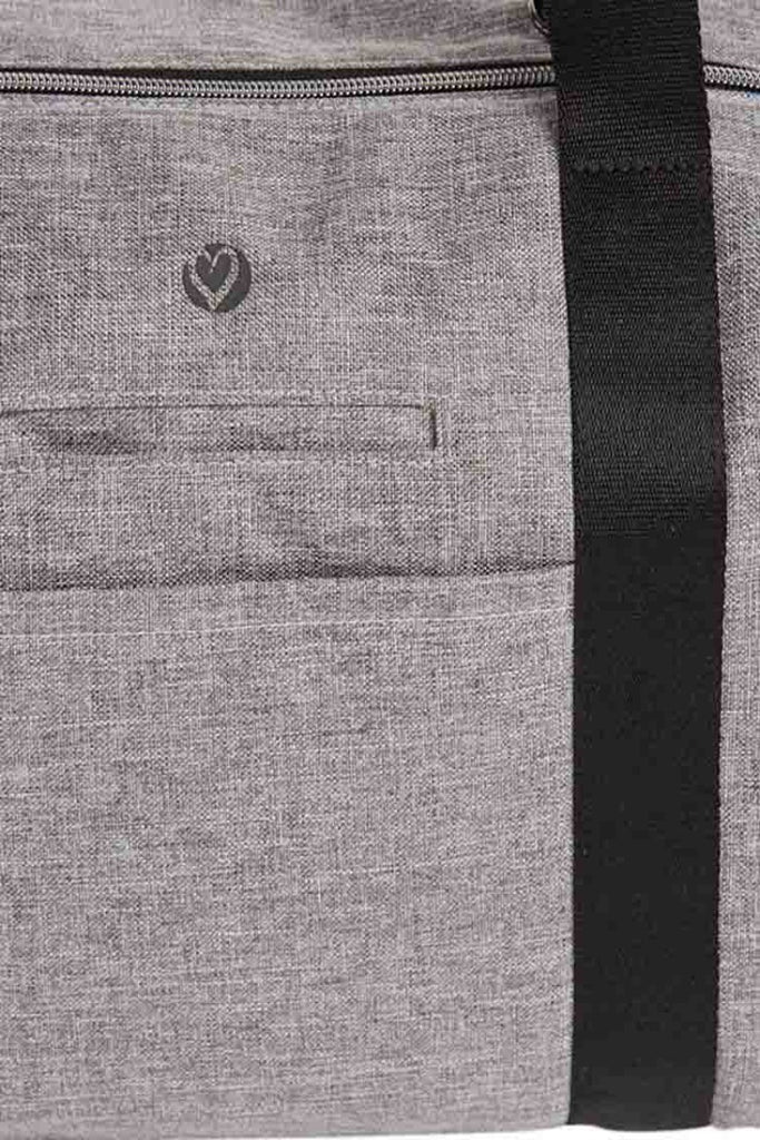 A close look at one of the exterior slip pockets on the HeartSoul Madison Duffel Bag in Heather Grey.