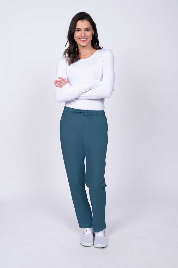 Young healthcare worker wearing a Luv Scrubs by MedWorks Women's Elastic Waist Cargo Pant in Caribbean featuring a natural rise and straight legs.