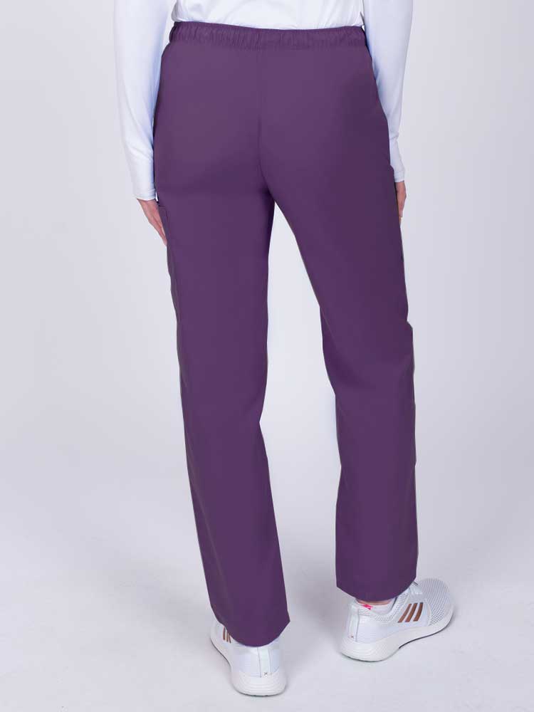 Nurse wearing a Luv Scrubs by MedWorks Women's Elastic Waist Cargo Pant in eggplant with an elastic and drawstring waist.