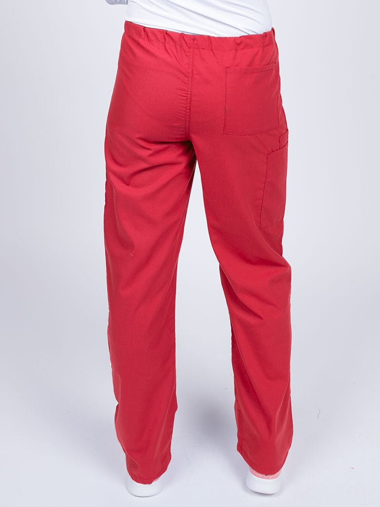 A young female LPN wearing a Luv Scrubs Unisex Drawstring Cargo Pant in Red with one back pocket on the wearer's right side.