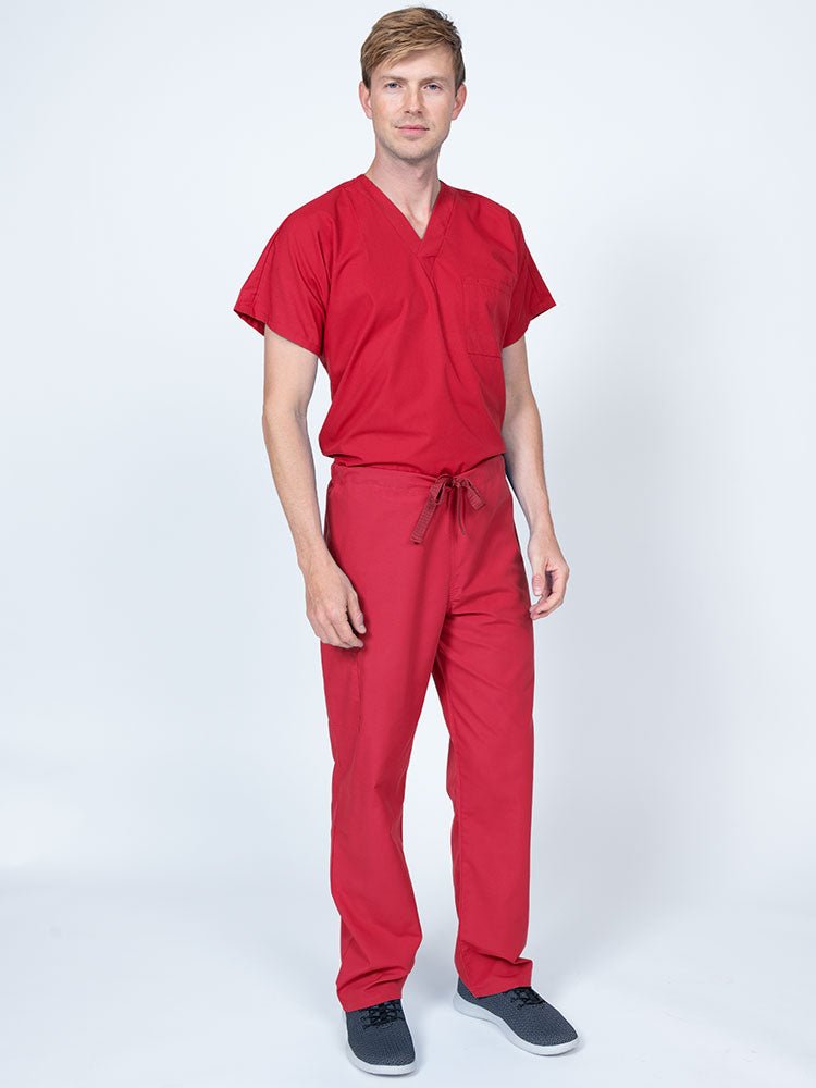 A male Nursing Assistant wearing a Luv Scrubs Drawstring Cargo Pant in Red featuring a unisex fit.