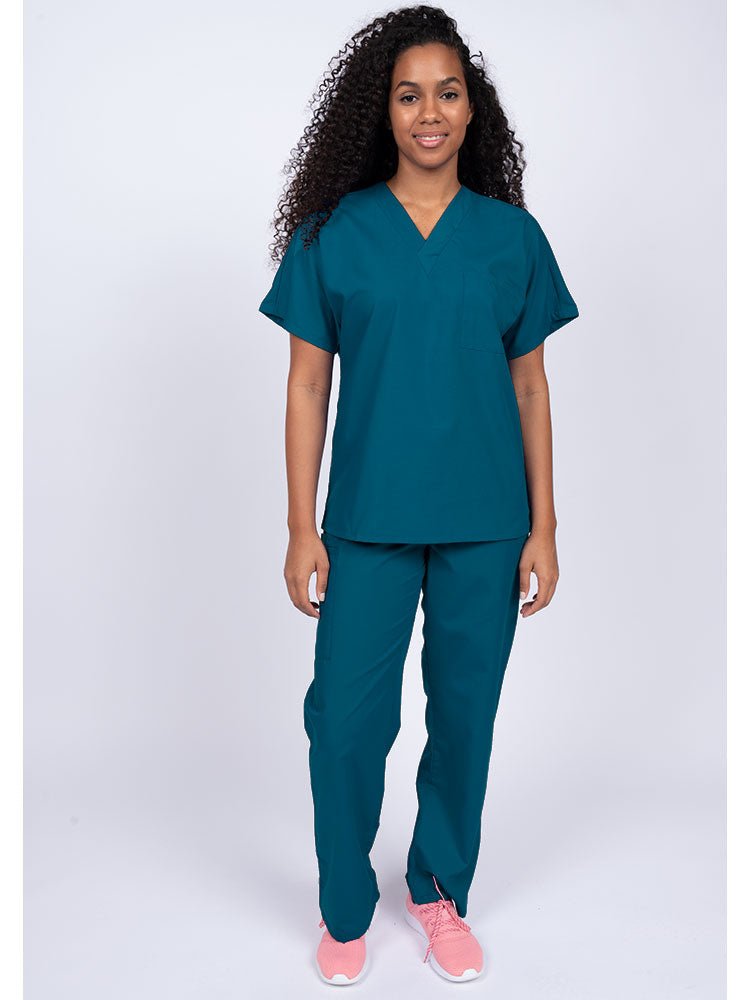 Young woman wearing a Luv Scrubs Unisex Single Pocket Scrub Top in Caribbean featuring a V-neckline.