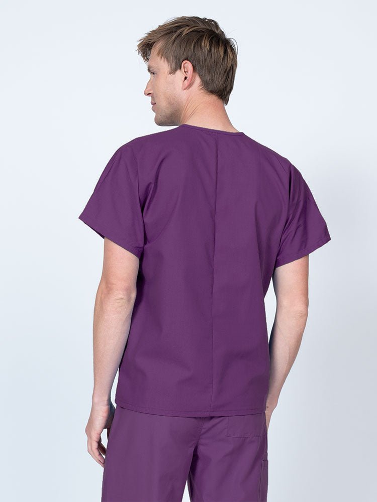 Male LPN wearing a Luv Scrubs Unisex Single Pocket V-Neck Scrub Top in Eggplant with a lightweight, breathable fabric made of 55% Cotton and 45% Polyester.