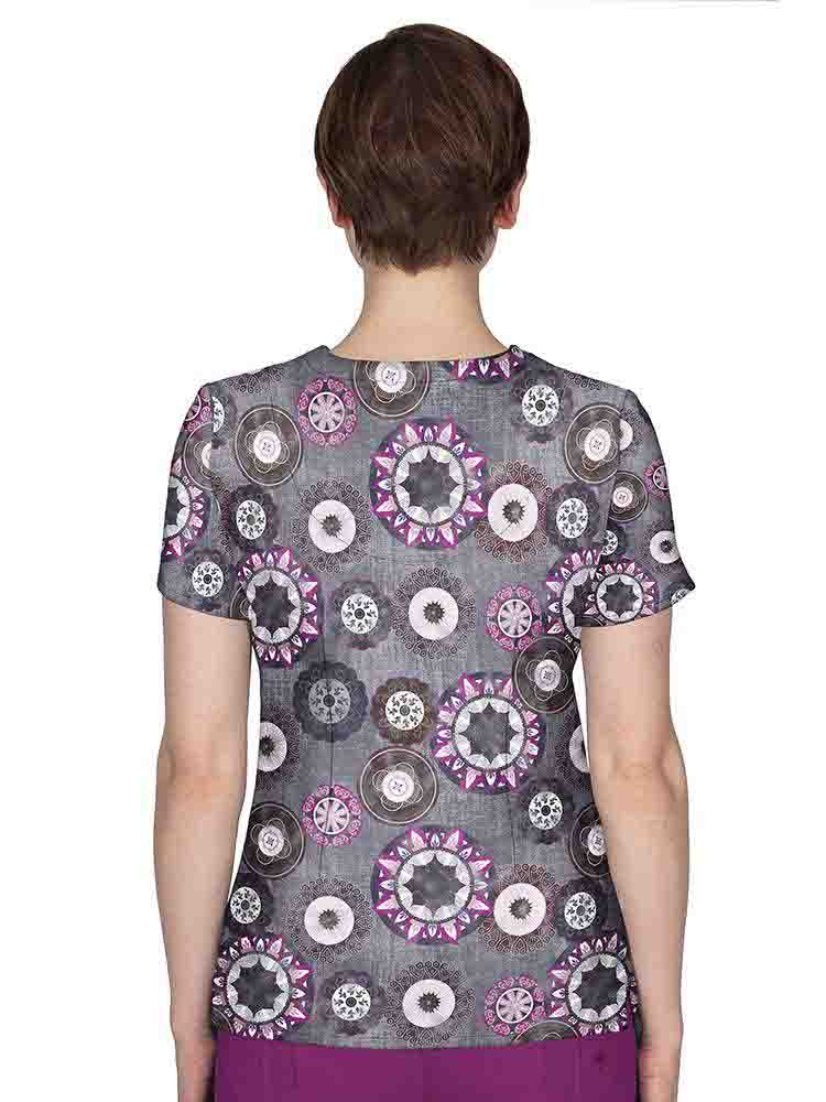 The back of the Premiere by Healing Hands Women's Amanda Print Top in "Festival Carnival" featuring a center back length of 26.5".