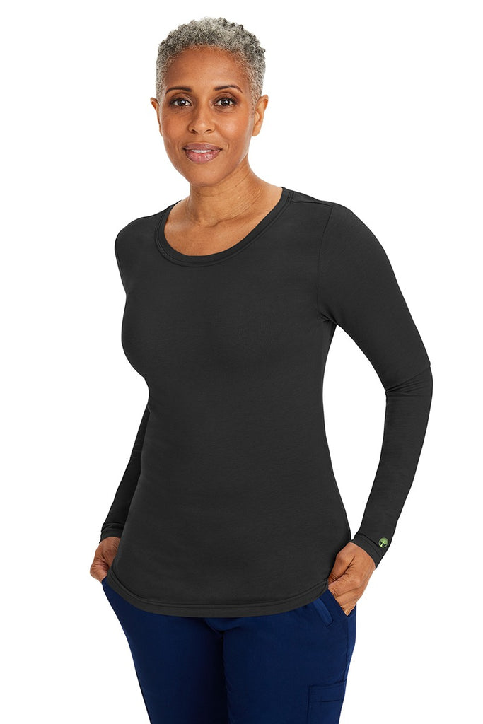 A lady CNA wearing a Purple Label Women's Melissa Long Sleeve T-Shirt in Black  featuring a slim fit to provide a flattering all day look.