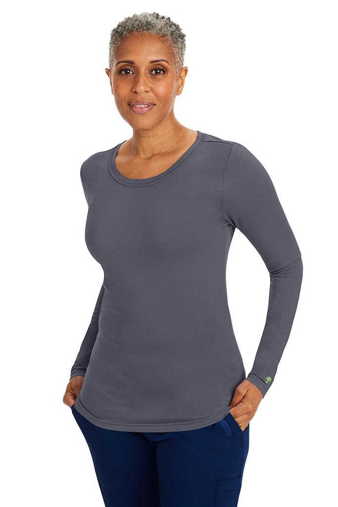 A young woman wearing a Purple Label Women's Melissa Long Sleeve T-Shirt from Healing Hands in Pewter featuring a modern fit & a shaped body.