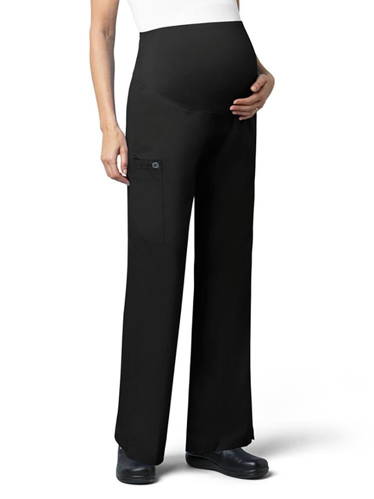 A female Veterinary Technician wearing a Wonderwink women's Maternity Cargo Scrub Pant in black size extra small featuring a silky knit waist panel.