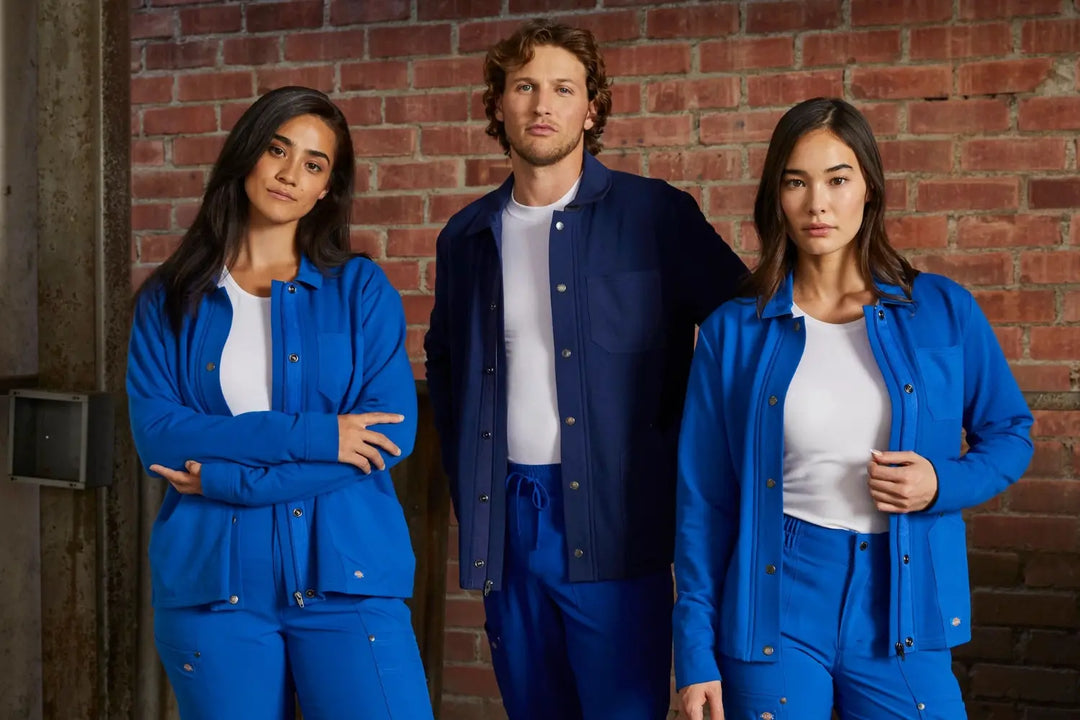 Group of nurses wearing warm-up jackets in royal blue and navy.