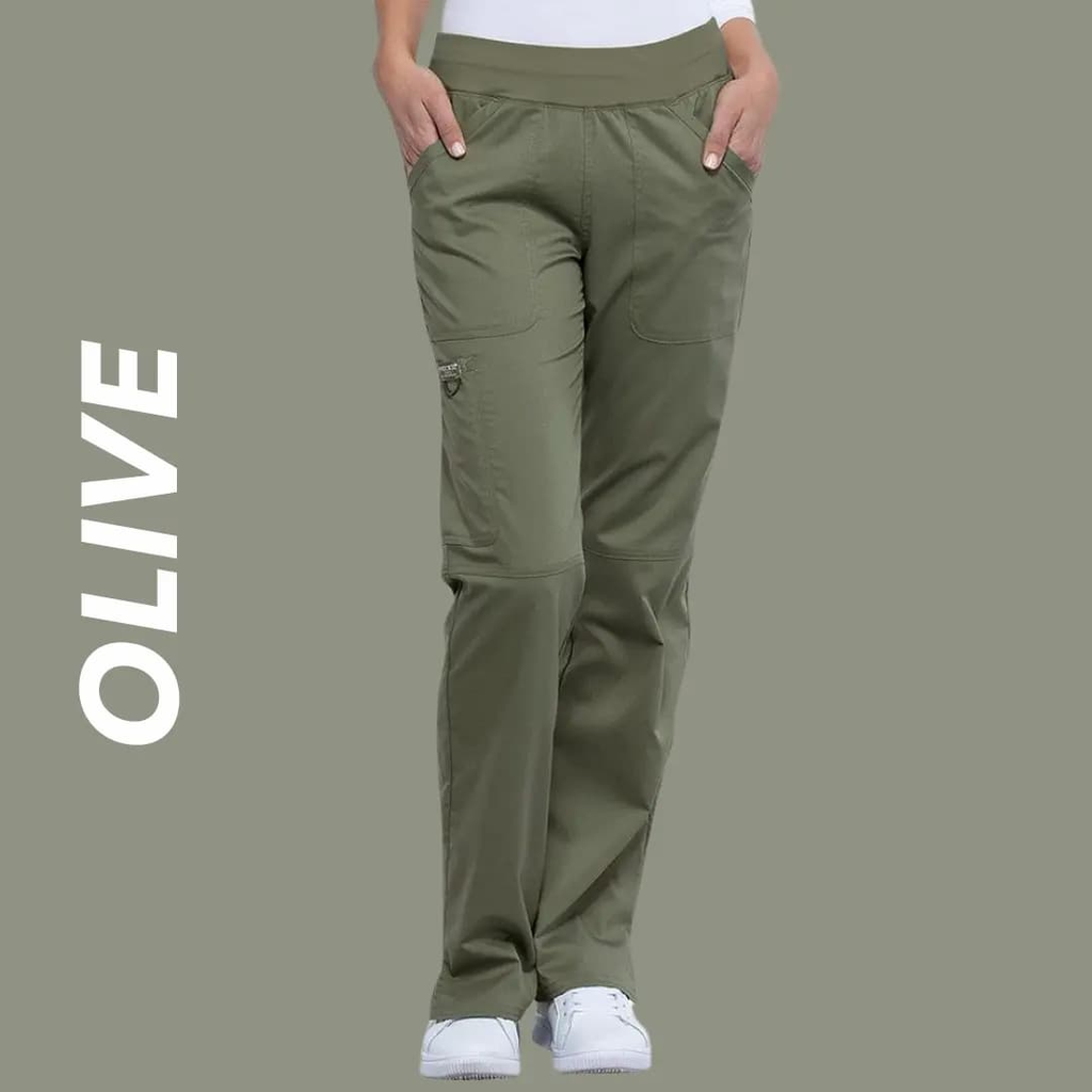A young female Surgeon wearing Olive Green scrub pants on a light green background with text to the left stating "Olive".
