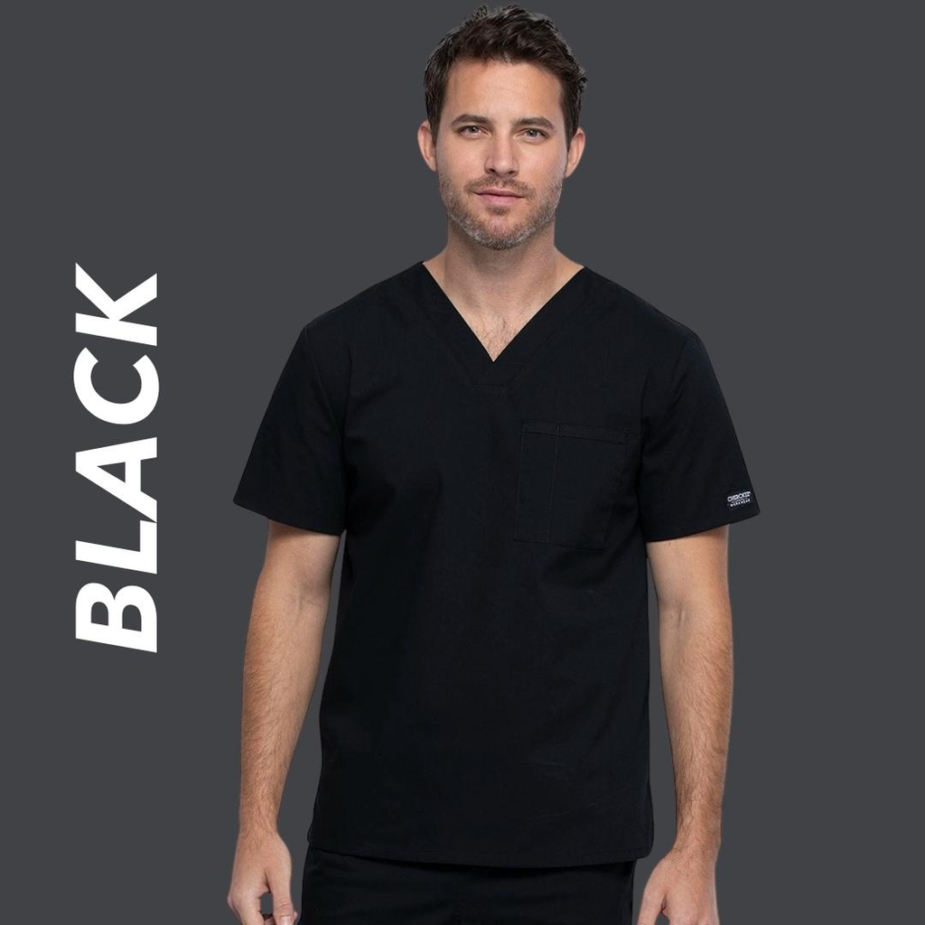 A young male surgical assistant wearing black scrubs on a charcoal background with text to the left stating "Black".