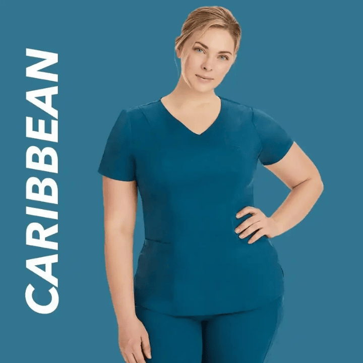 A young female Nurse Practitioner wearing Caribbean Blue scrubs on a blue/green back background with text to the left stating "Caribbean".