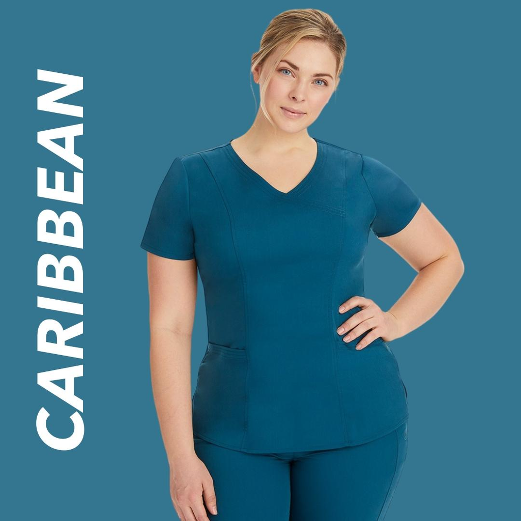A young female Nurse Practitioner wearing Caribbean Blue scrubs on a blue/green back background with text to the left stating "Caribbean".