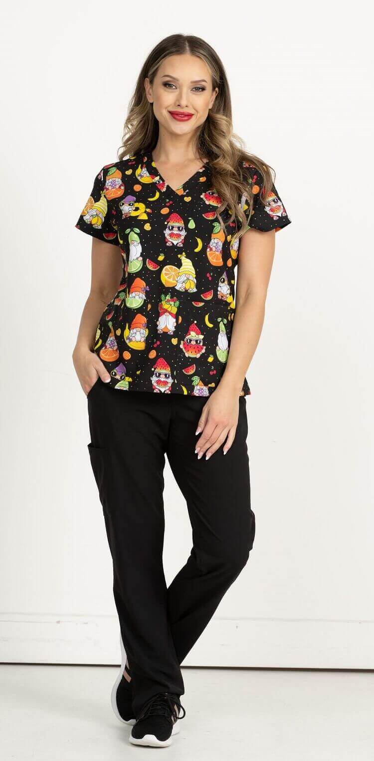 A female Phlebotomist wearing a Women's Print Scrub Top from Meraki Sport in "Gnome Sweet Gnome" size Small featuring 2 front patch pockets & shoulder yokes for a flattering shape.